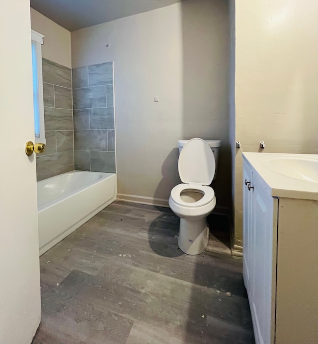 bathroom featuring wood-type flooring, vanity, and toilet