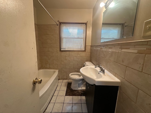 full bathroom with tile patterned flooring, tile walls, toilet, vanity, and shower / bathtub combination