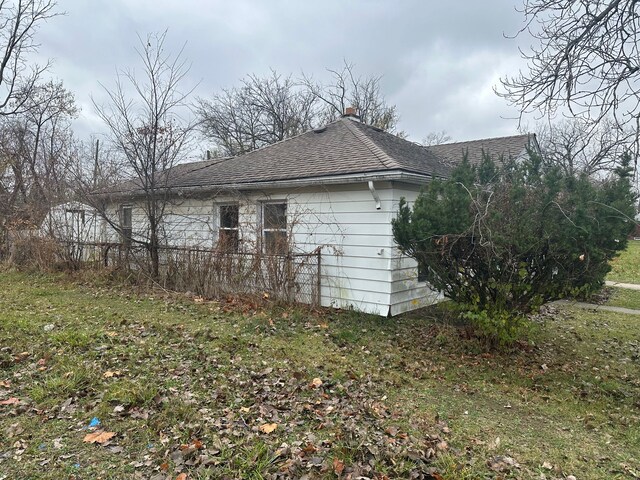 20511 Lyndon St, Detroit, MI 48223 - view of side of home featuring roof with shingles