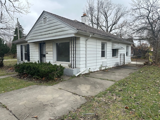 20511 Lyndon St, Detroit, MI 48223 - view of front facade featuring a chimney
