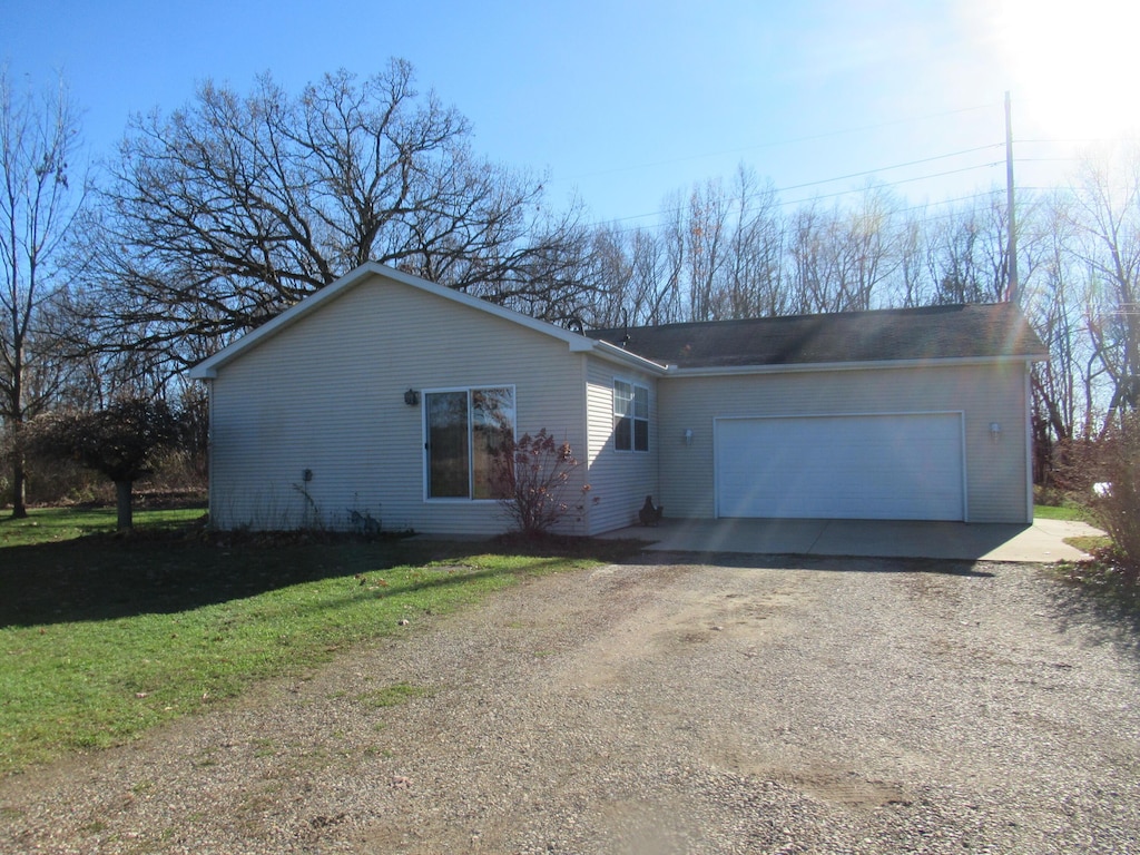 single story home featuring a garage