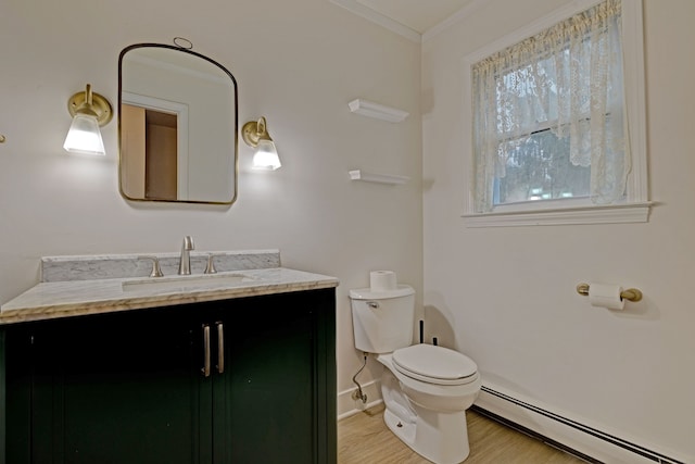 bathroom featuring vanity, crown molding, a baseboard radiator, hardwood / wood-style flooring, and toilet