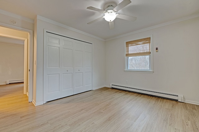 unfurnished bedroom with ceiling fan, light hardwood / wood-style floors, and baseboard heating