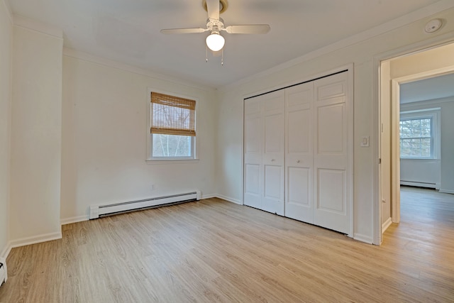 unfurnished bedroom with crown molding, ceiling fan, light hardwood / wood-style flooring, and a baseboard radiator