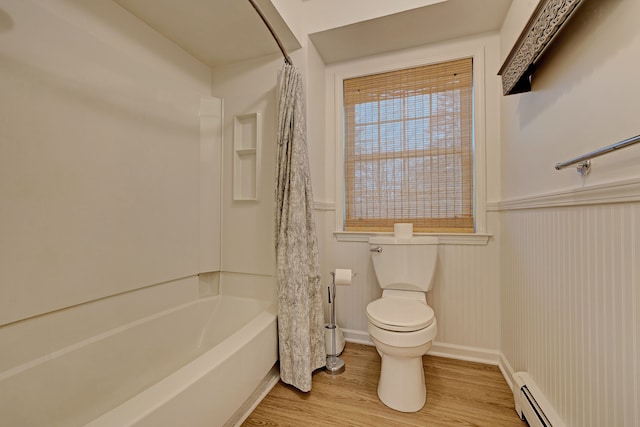 bathroom featuring baseboard heating, shower / bathtub combination with curtain, wood-type flooring, and toilet