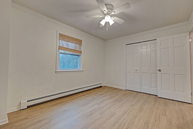 unfurnished bedroom with a closet, light hardwood / wood-style floors, ceiling fan, and a baseboard heating unit