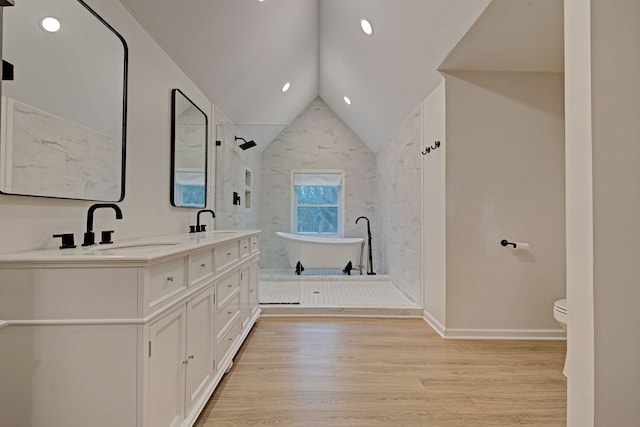 full bathroom with wood-type flooring, vaulted ceiling, toilet, vanity, and shower with separate bathtub