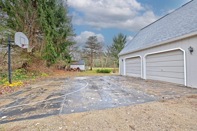 garage featuring basketball hoop