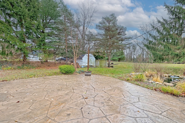 view of patio featuring a shed