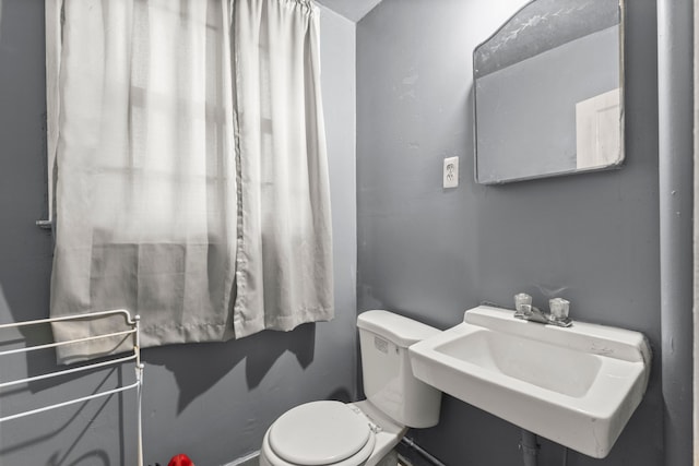 bathroom with sink and toilet