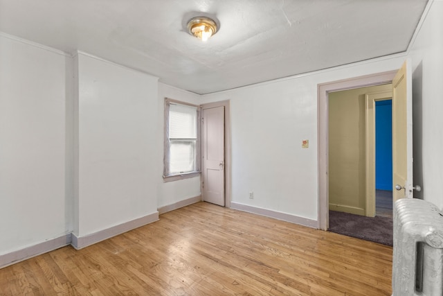 spare room with light hardwood / wood-style floors