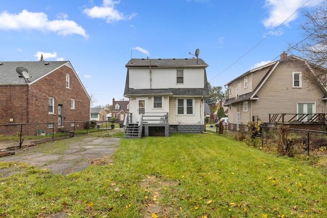 back of house with a yard