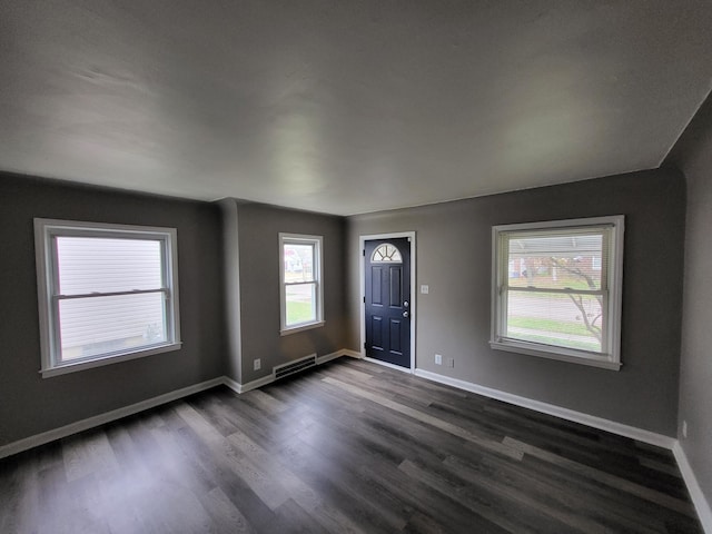 20501 Elkhart St, Harper Woods, MI 48225 - foyer entrance with dark wood-style flooring and baseboards