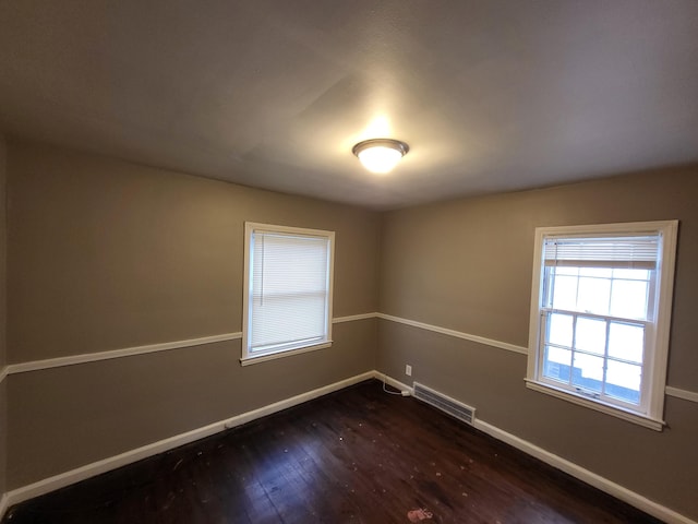 20501 Elkhart St, Harper Woods, MI 48225 - spare room with dark wood-style floors and baseboards