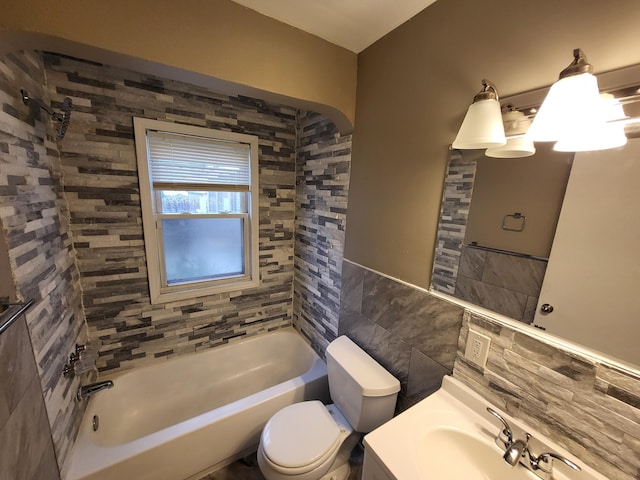 20501 Elkhart St, Harper Woods, MI 48225 - full bathroom with tile walls, toilet, shower / washtub combination, vanity, and a wainscoted wall