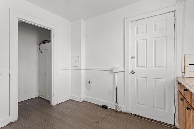 laundry area with hardwood / wood-style floors