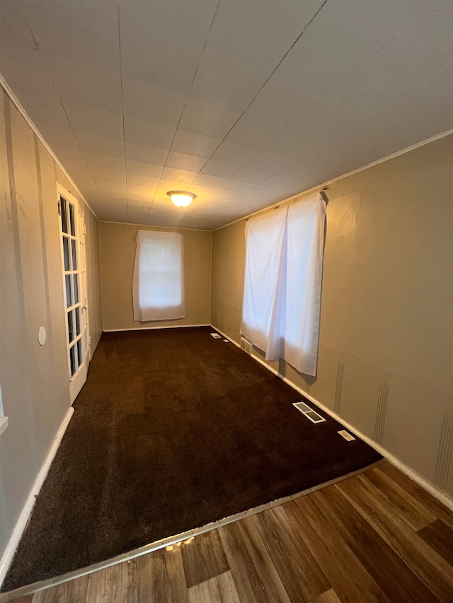 empty room with dark hardwood / wood-style floors