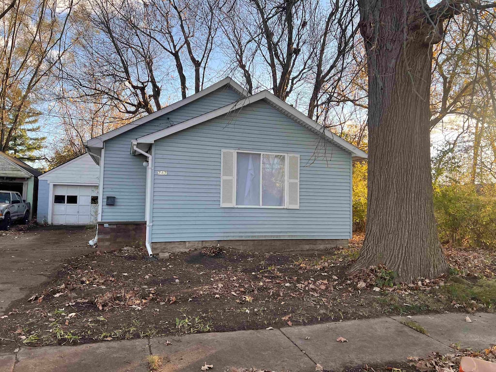 view of side of property featuring a garage