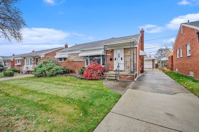 view of front of house featuring a garage and a front yard