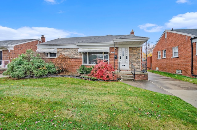 bungalow-style home with stone siding, brick siding, a chimney, and a front yard