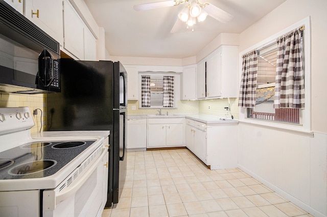 kitchen with sink, backsplash, white cabinets, light tile patterned floors, and white appliances