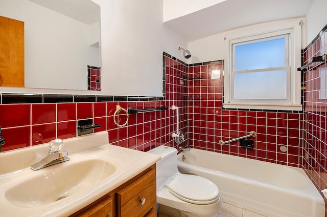 full bathroom with tiled shower / bath combo, vanity, tile walls, and toilet