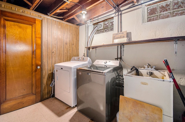 laundry room featuring laundry area, light floors, and washing machine and dryer