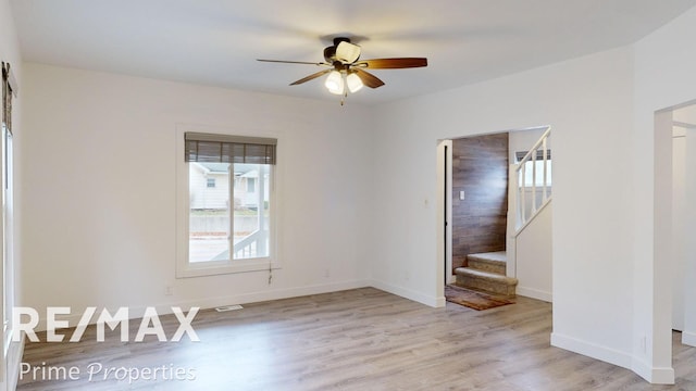 unfurnished room with ceiling fan and light hardwood / wood-style flooring