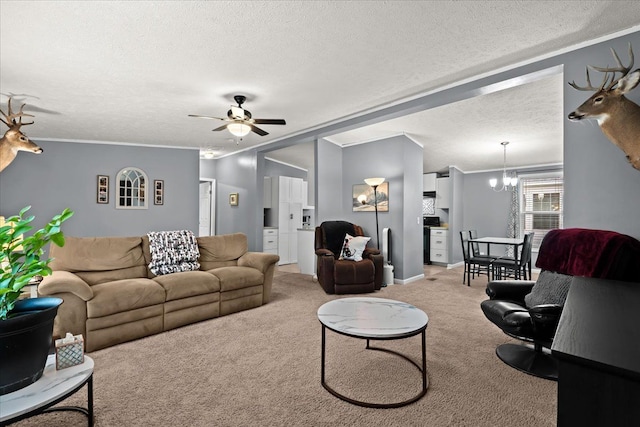 living room with ceiling fan with notable chandelier, crown molding, a textured ceiling, and light carpet