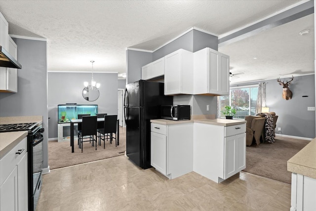 kitchen featuring pendant lighting, a textured ceiling, white cabinets, black appliances, and ceiling fan with notable chandelier