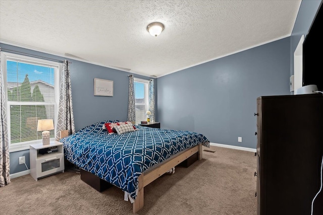 bedroom with carpet floors, a textured ceiling, and multiple windows