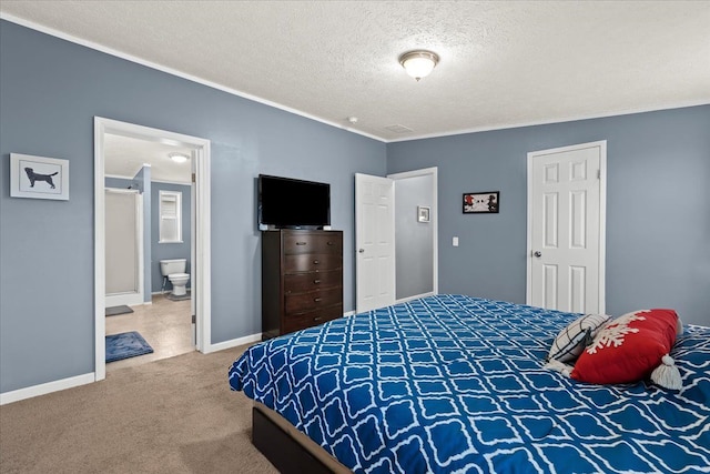 bedroom with carpet flooring, ornamental molding, a textured ceiling, and connected bathroom