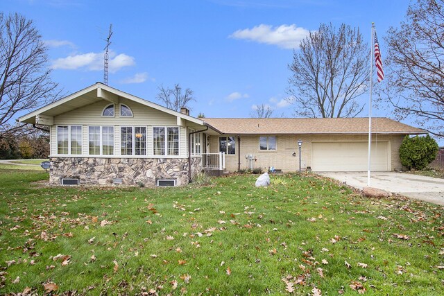 7349 E Main St, Eau Claire, MI 49111 - ranch-style home featuring concrete driveway, a front lawn, a garage, and stone siding
