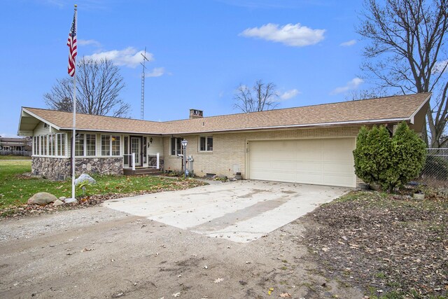 7349 E Main St, Eau Claire, MI 49111 - ranch-style home featuring a garage, brick siding, driveway, and a chimney