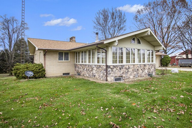 7349 E Main St, Eau Claire, MI 49111 - view of side of home featuring a chimney, a yard, and stone siding