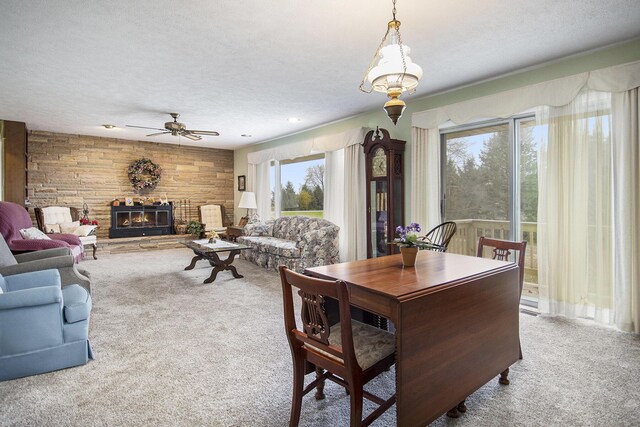 7349 E Main St, Eau Claire, MI 49111 - dining space with carpet floors, ceiling fan, a textured ceiling, and a fireplace