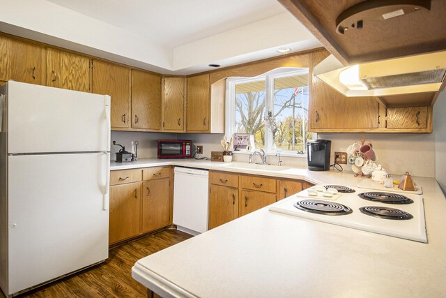 7349 E Main St, Eau Claire, MI 49111 - kitchen featuring white appliances, a sink, light countertops, dark wood-style flooring, and brown cabinetry