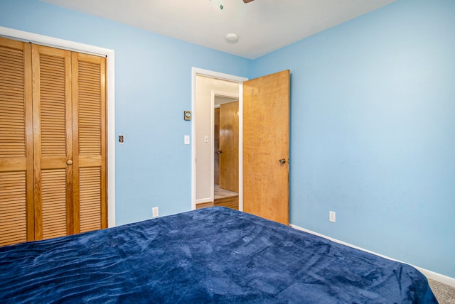 unfurnished bedroom featuring carpet and a closet