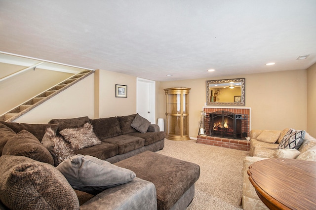 living room with carpet floors and a fireplace