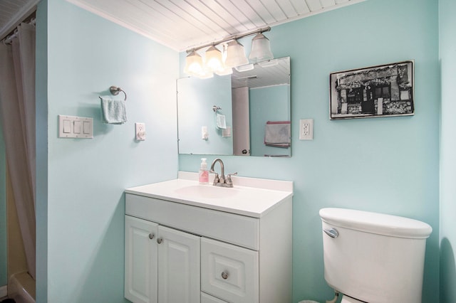 bathroom with ornamental molding, vanity, wood ceiling, and toilet