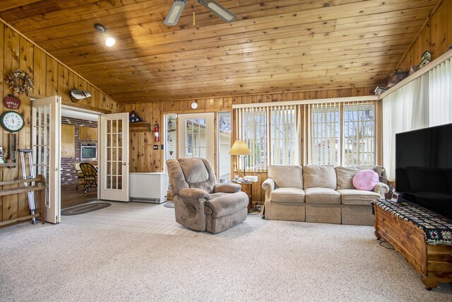 7349 E Main St, Eau Claire, MI 49111 - living area featuring french doors, wooden walls, lofted ceiling, wood ceiling, and carpet flooring