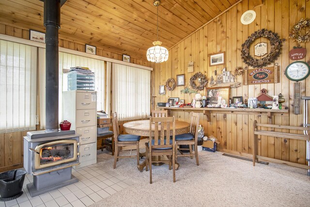 7349 E Main St, Eau Claire, MI 49111 - dining area with a wood stove, vaulted ceiling, wooden walls, wooden ceiling, and a chandelier