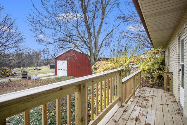 7349 E Main St, Eau Claire, MI 49111 - wooden terrace featuring an outdoor structure and a detached garage