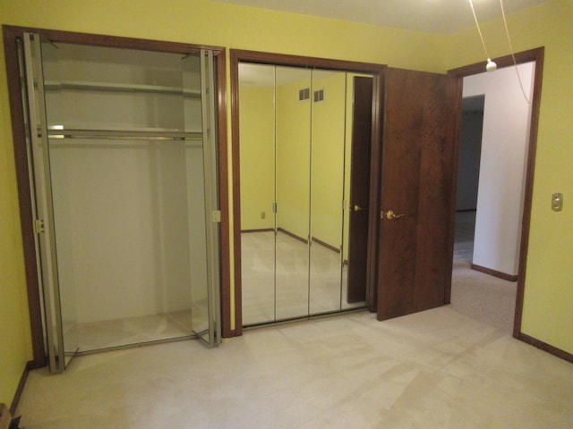 unfurnished bedroom featuring light colored carpet