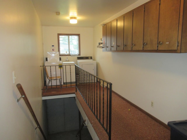 staircase featuring washer / dryer, carpet floors, and sink