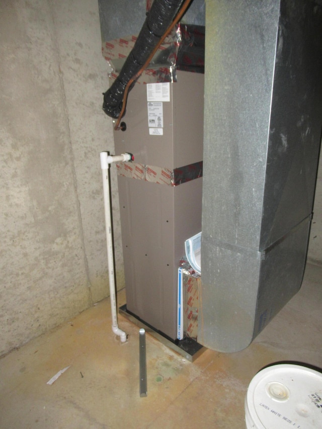 utility room with heating unit