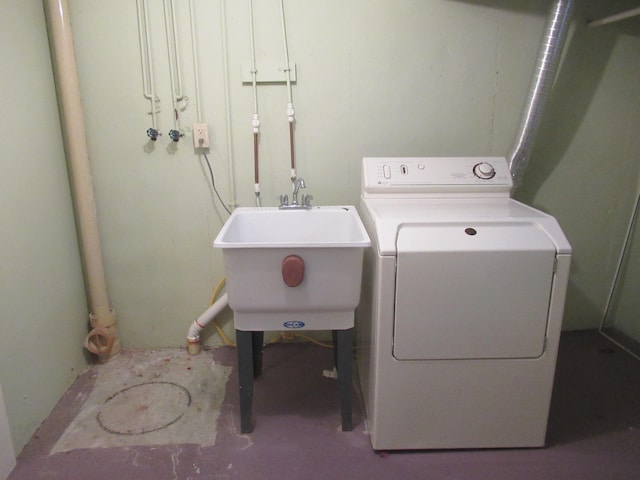 laundry room featuring washer / dryer and sink