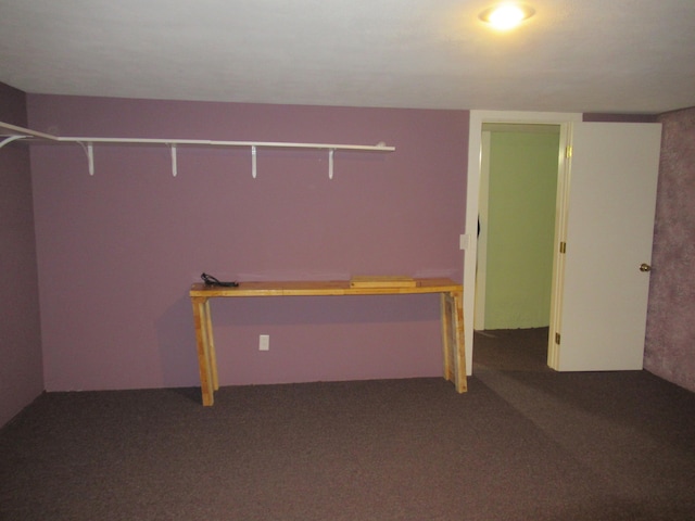 basement featuring carpet flooring