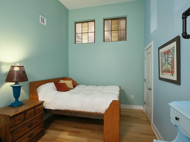 bedroom with light hardwood / wood-style floors