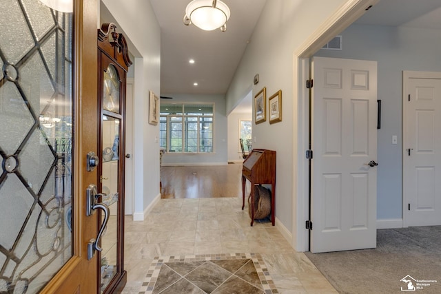 foyer entrance featuring recessed lighting, visible vents, and baseboards